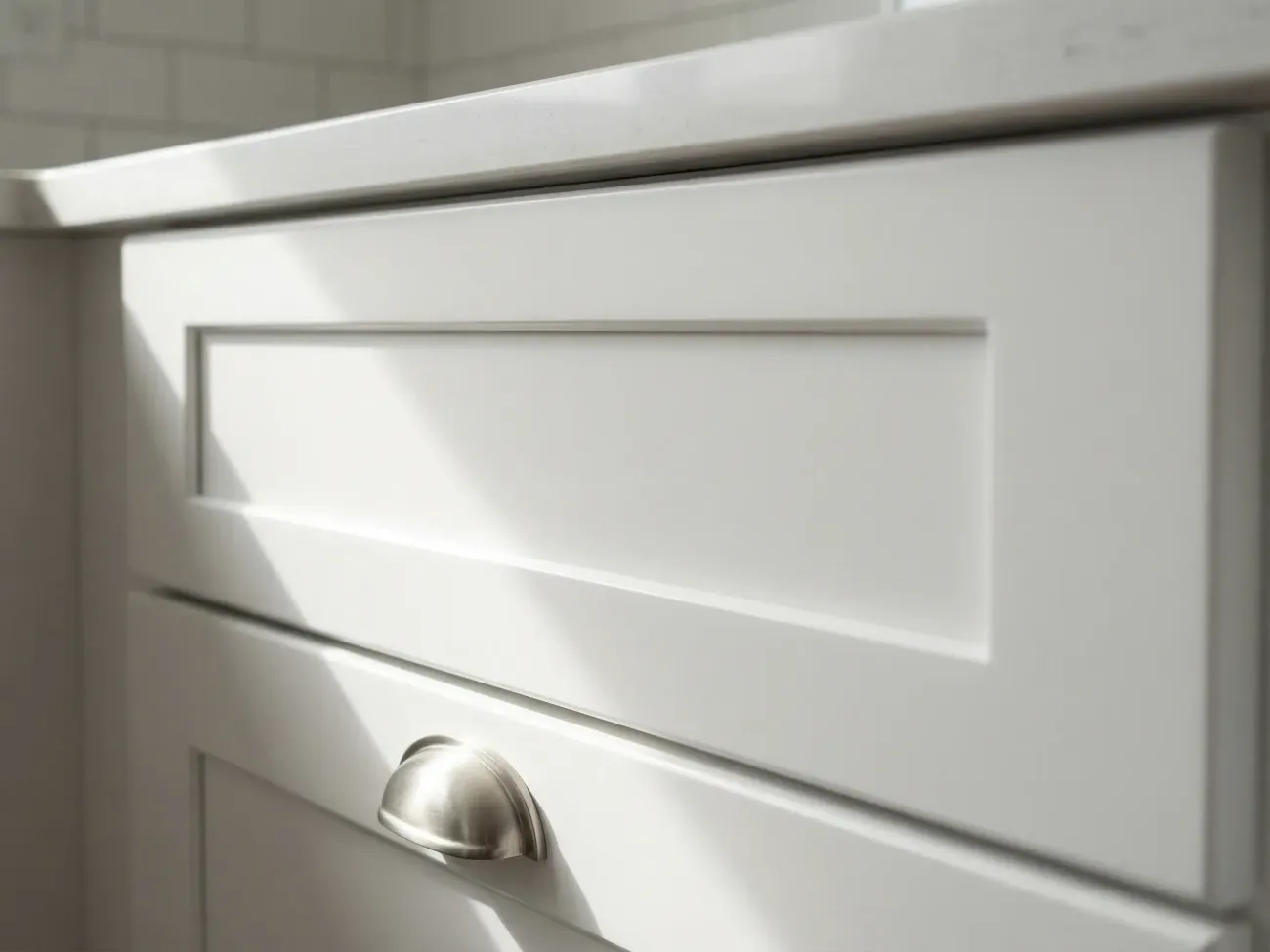 Close-up of spray-finished cabinet door showing smooth, leveled surface