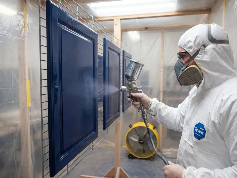 Professional HVLP spray application of cabinet-grade finish on doors