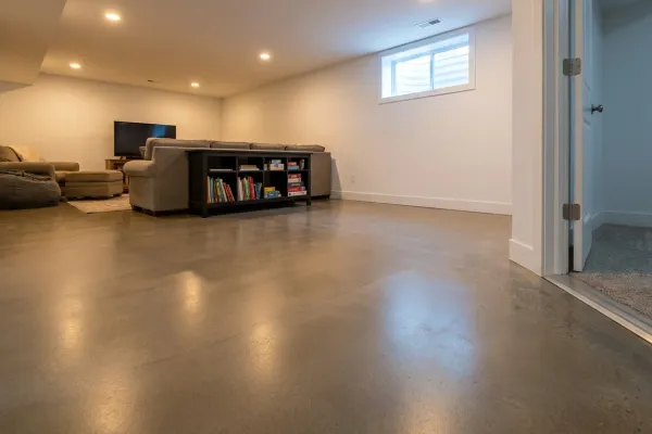 Basement floor with epoxy coating providing a clean, sealed surface