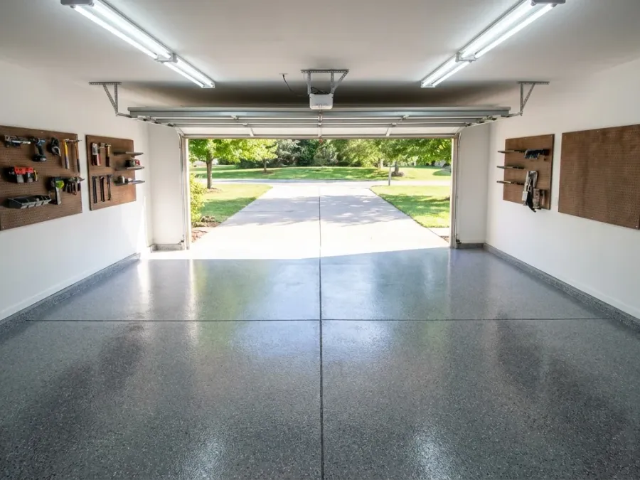Residential garage floor with professional epoxy coating and decorative flake