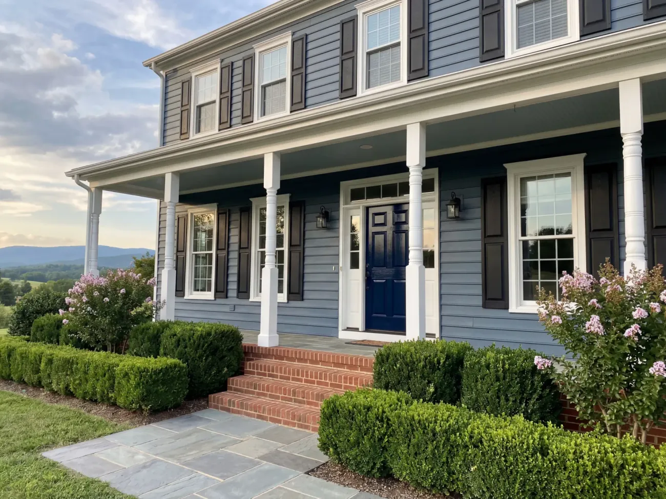 Colonial home exterior repaint with slate blue siding and white trim
