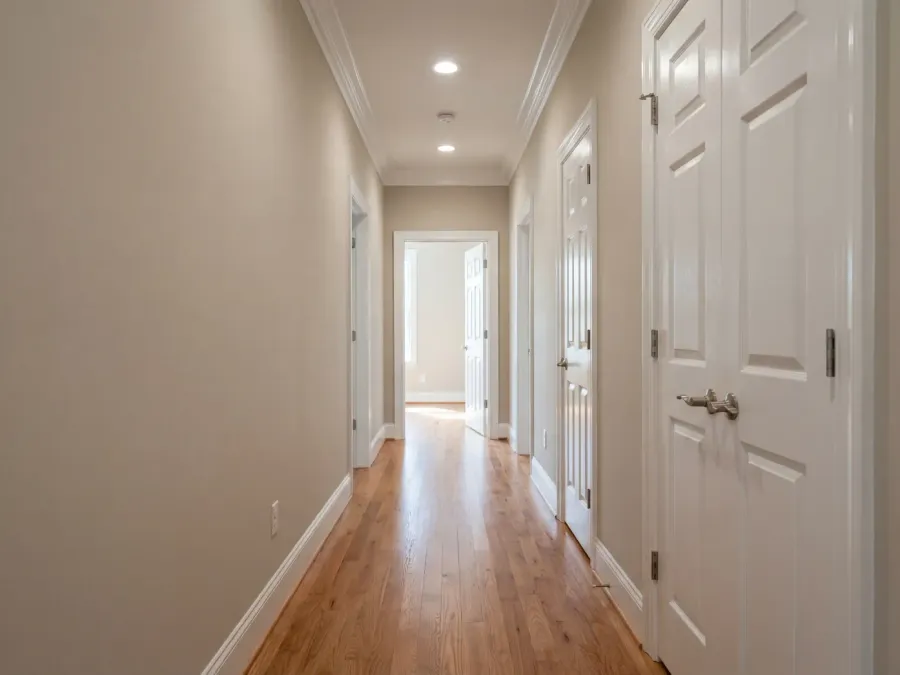 Long hallway with fresh paint and crisp white trim detail