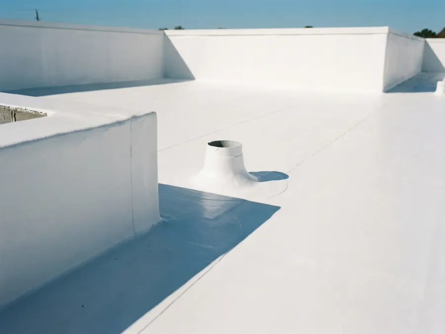 Flat roof with elastomeric waterproof coating