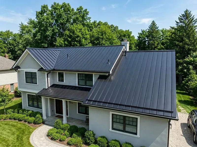 Metal roof with fresh protective coating applied by Greystone Painting